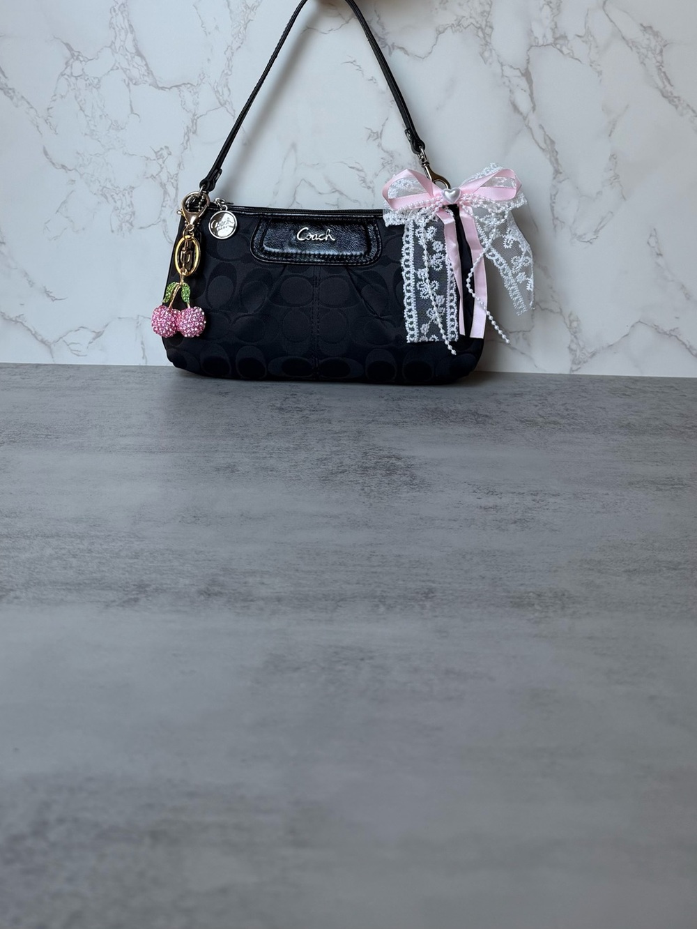 Coach Black Shoulder Bag with Pink Ribbon and Cherry Charm